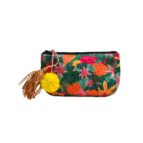 Anna's mini toiletry bag featuring a green tropical floral pattern with a decorative yellow pom-pom and brown leather tassel.