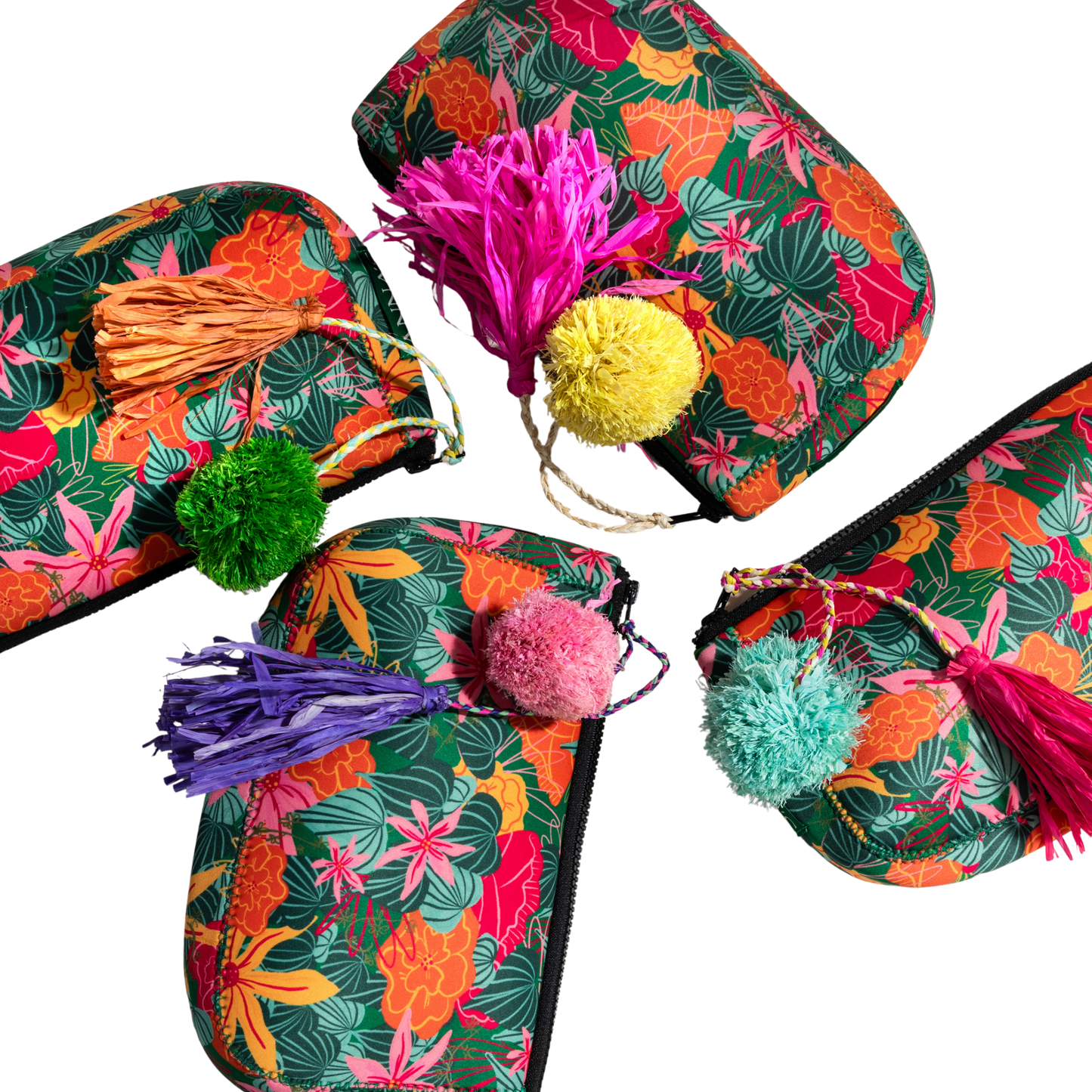 ANNAs Colorful slippers with floral patterns and pom-poms on a white background