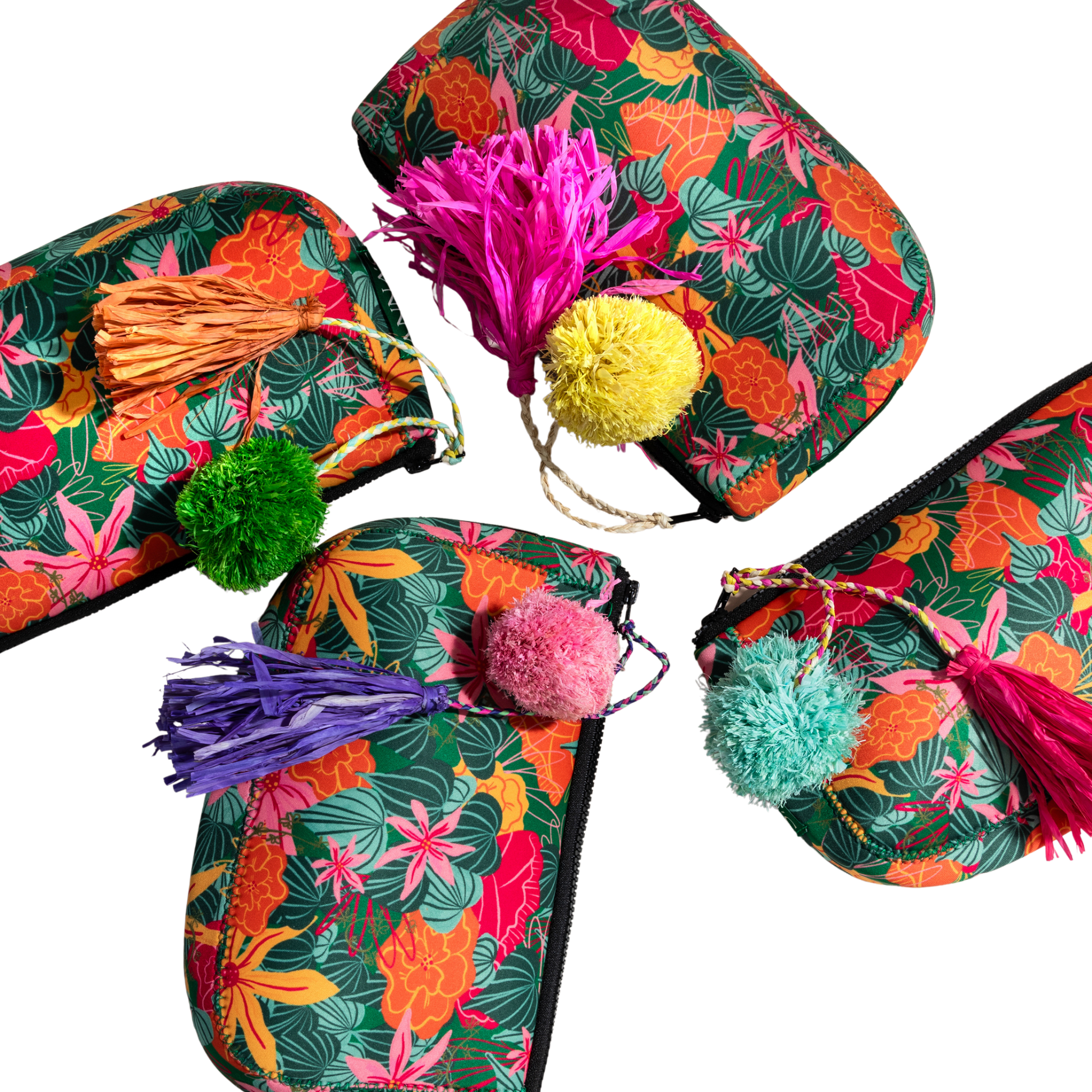 ANNAs Colorful slippers with floral patterns and pom-poms on a white background