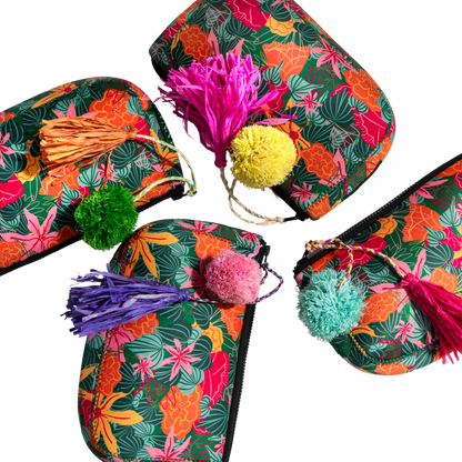 ANNAs Colorful slippers with floral patterns and pom-poms on a white background