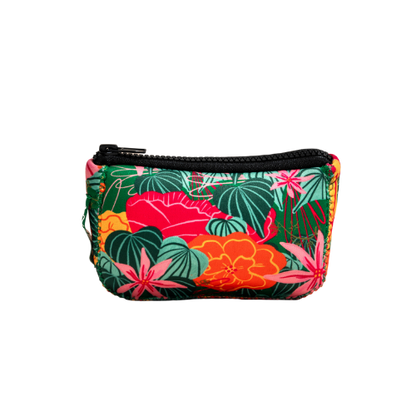 Anna's mini toiletry bag showing the continuous green, pink, and orange tropical floral design with a black zipper