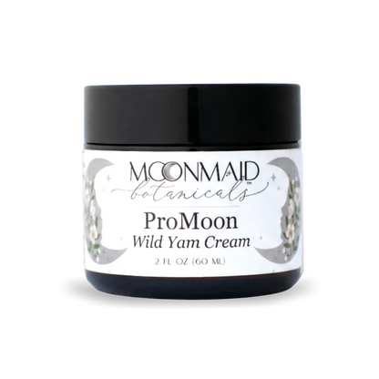 A 2 fl oz amber glass jar with a black screw-top lid featuring MoonMaid Botanicals ProMoon Wild Yam Cream against a solid dark background.