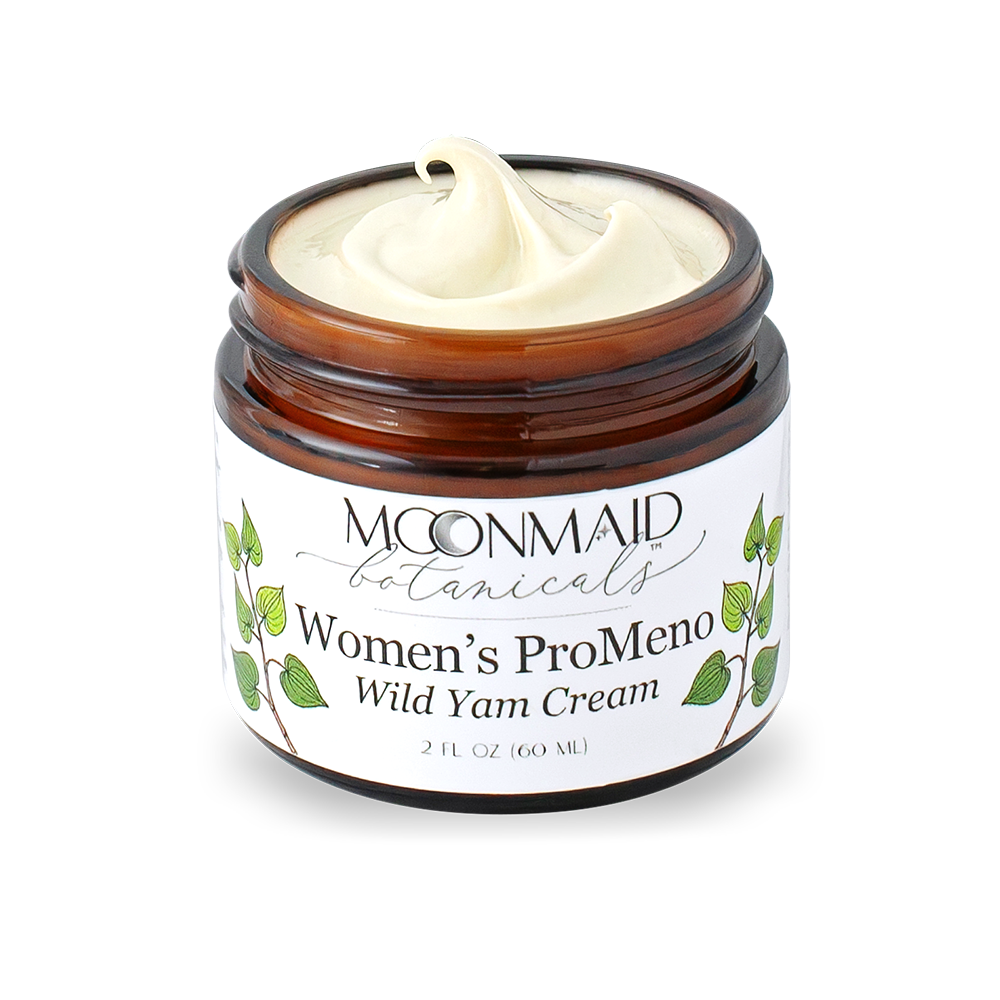 Open jar of Moonmaid Botanicals ProMeno Wild Yam Cream showing a close-up of the smooth, whipped natural cream texture.