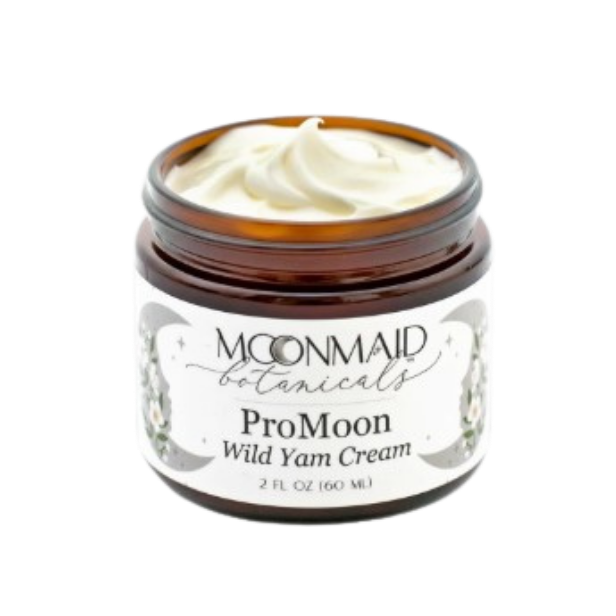 An angled close-up view of an open jar of Moonmaid Botanicals ProMoon Wild Yam Cream, highlighting its rich, whipped natural texture.